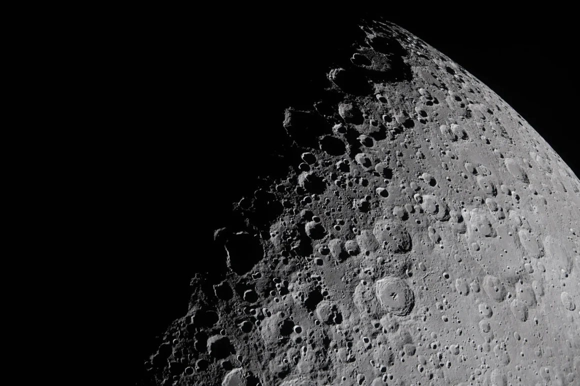 Artemis II image showing the Moon’s surface along the terminator with long shadows across craters and ridges