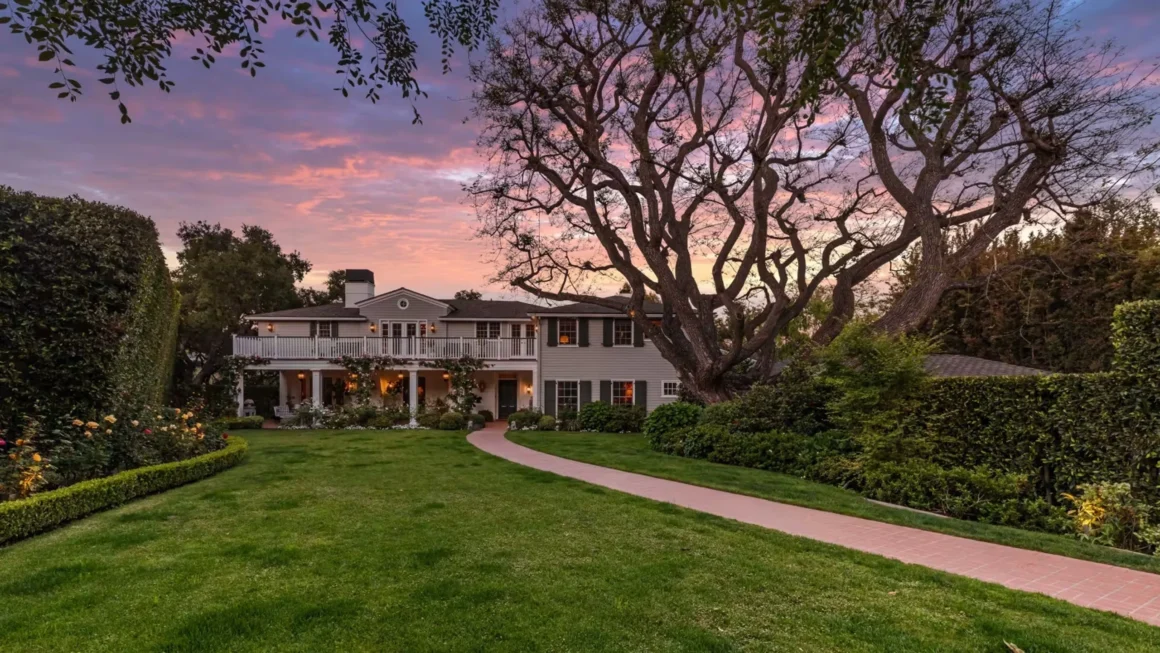 Large Georgian-style house with a wide lawn and landscaped garden associated with Audrey Hepburn