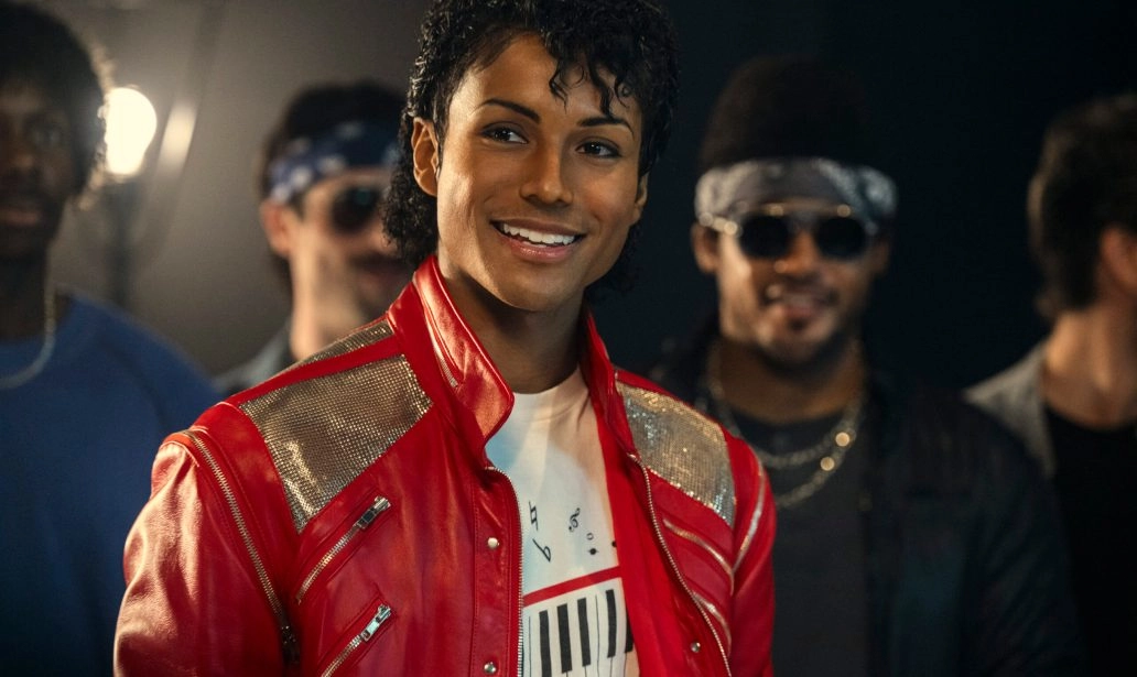 Michael Jackson biopic scene showing Jaafar Jackson performing in red jacket