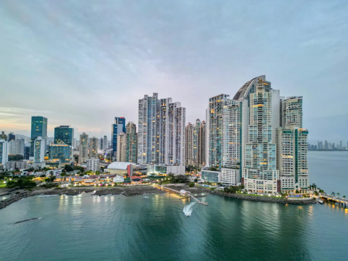 Panama City skyline along the waterfront at dusk.