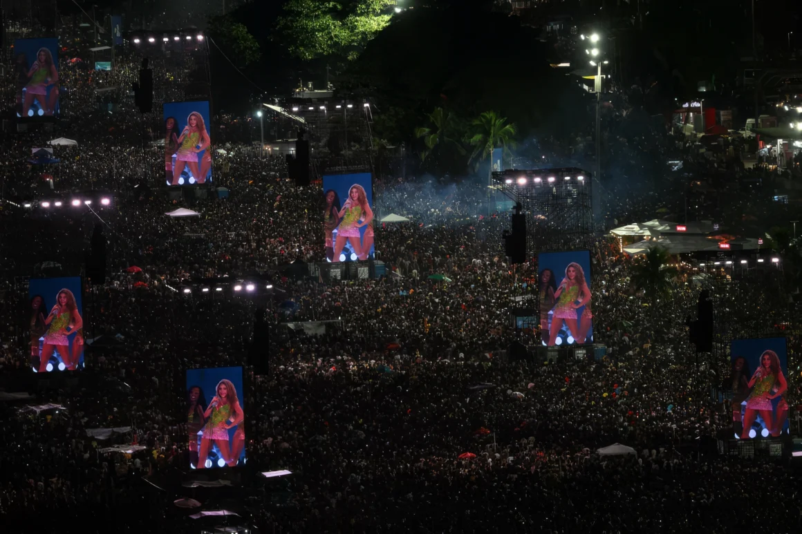 Shakira Copacabana concert crowd watches the performance on large screens in Rio